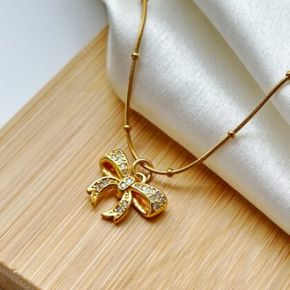 Golden Glimmer Bow Pendant
