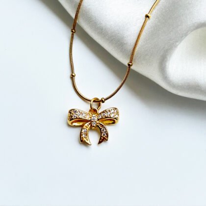 Golden Glimmer Bow Pendant